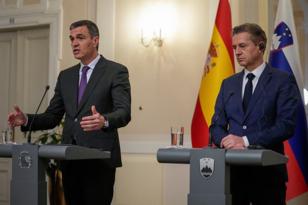 Prime Minister of Spain Pedro Sanchez, left, addresses the media after meeting his Slovenian counterpart Robert Golob, right, in Ljubljana, Slovenia, Tuesday, April 16, 2024. (AP Photo/Darko Bandic)
