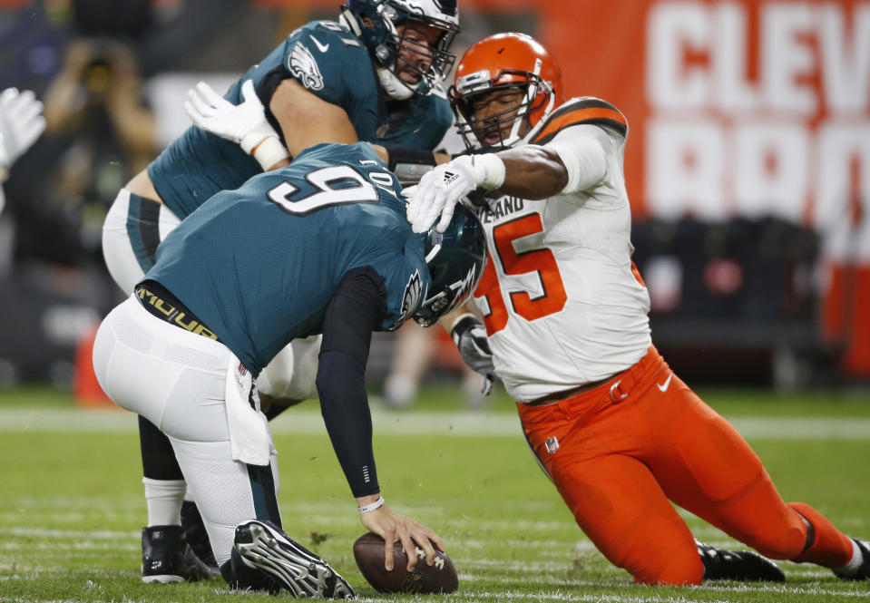 Cleveland Browns defensive end Myles Garrett (95) takes down Philadelphia Eagles quarterback Nick Foles (9) for a safety during the first half of an NFL preseason football game Thursday, Aug. 23, 2018, in Cleveland. (AP Photo/Ron Schwane)