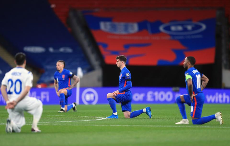 England take the knee ahead of a match (PA Wire)