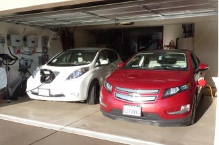 2011 Nissan Leaf and 2011 Chevy Volt, with charging station visible; photo by George Parrott