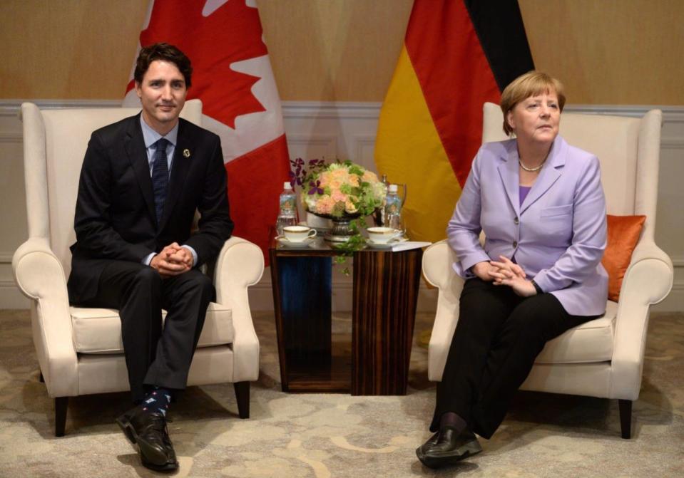 Prime Minister Justin Trudeau, left, and German Chancellor Angela Merkel take part in a bilateral meeting in Shima, Japan during the G7 Summit on Thursday, May 26, 2016. THE CANADIAN PRESS/Sean Kilpatrick