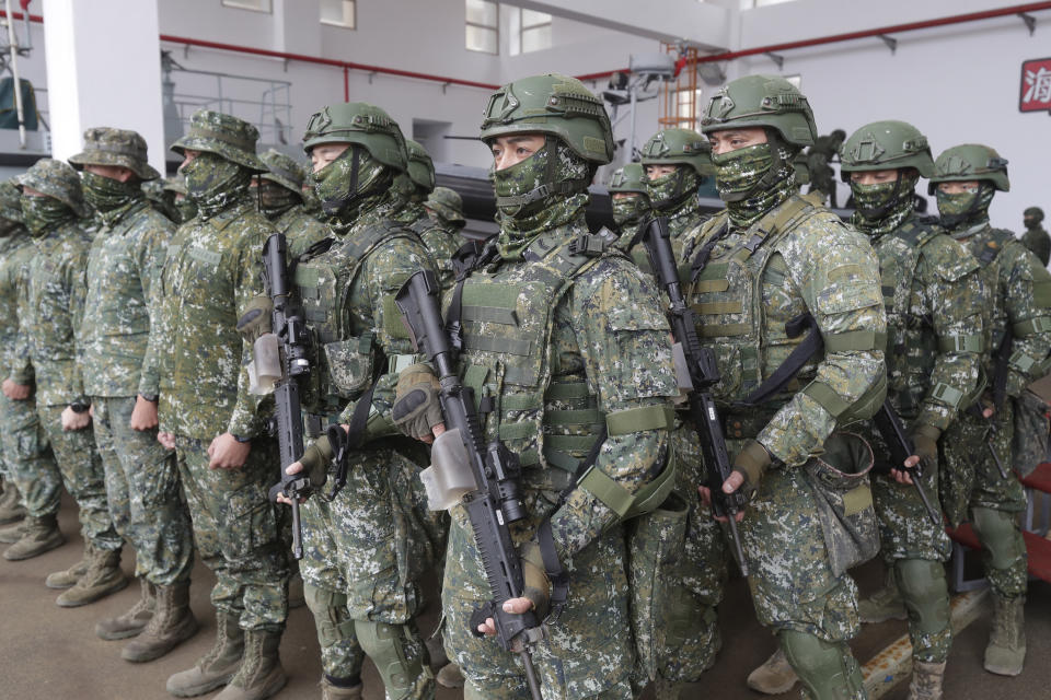 Soldiers line in formation as Taiwan President Tsai Ing-wen inspects at the Penghu Magong military base in outlying Penghu Island, Taiwan, Friday, Dec. 30, 2022. (AP Photo/ Chiang Ying-ying)