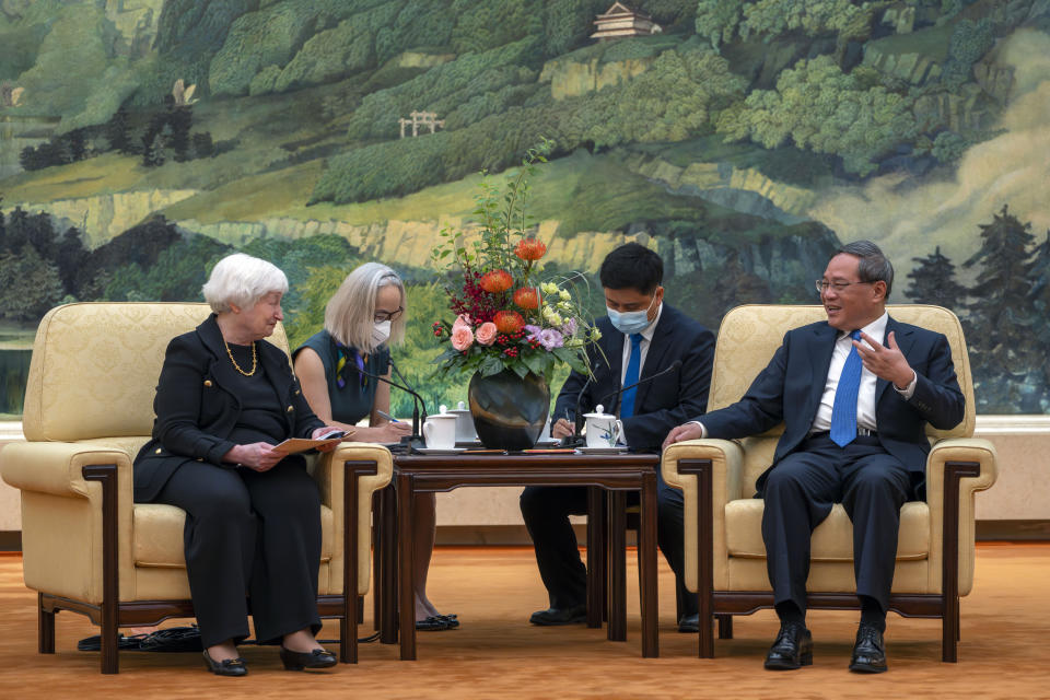 Chinese Premier Li Qiang, right, speaks as Treasury Secretary Janet Yellen, left, listens during a meeting at the Great Hall of the People in Beijing, China, Friday, July 7, 2023. (AP Photo/Mark Schiefelbein, Pool)