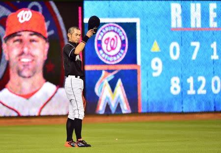 Miami Marlins left fielder Ichiro Suzuki (51) tips his cap to the crowd during the ninth inning against the Washington Nationals at Marlins Park. Mandatory Credit: Steve Mitchell-USA TODAY Sports