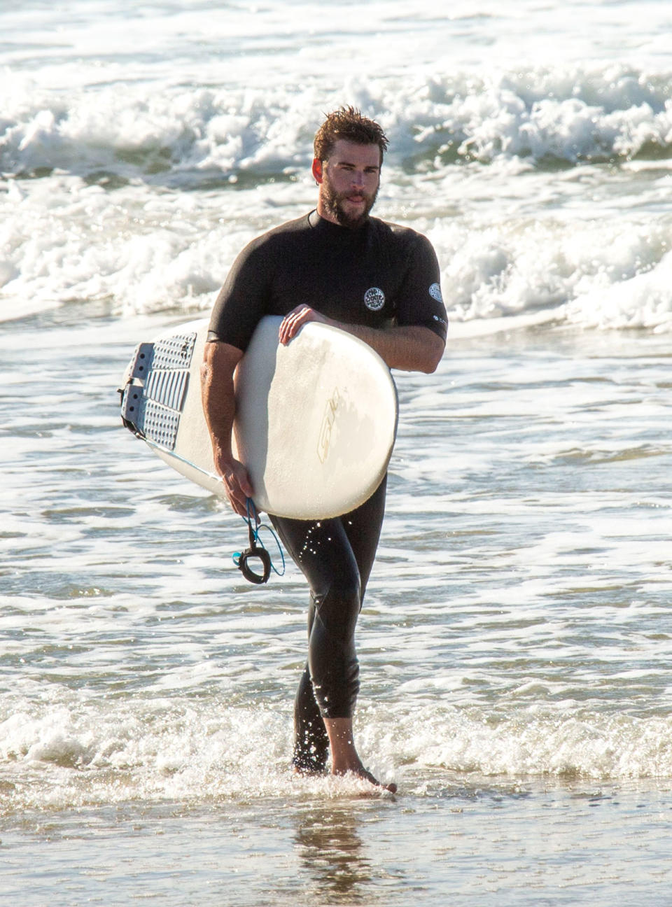 <p>Liam Hemsworth was spotted surfing with his brothers Liam and Luke Hemsworth in Byron Bay, Australia.</p>