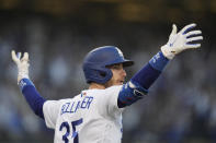 Los Angeles Dodgers center fielder Cody Bellinger reacts after hitting a three-run home run during the eighth inning in Game 3 of baseball's National League Championship Series against the Atlanta Braves Tuesday, Oct. 19, 2021, in Los Angeles. (AP Photo/Ashley Landis)