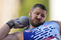 Joe Kovacs competes in the men's shot put during the U.S. track and field championships in Eugene, Ore., Sunday, July 9, 2023. (AP Photo/Ashley Landis)