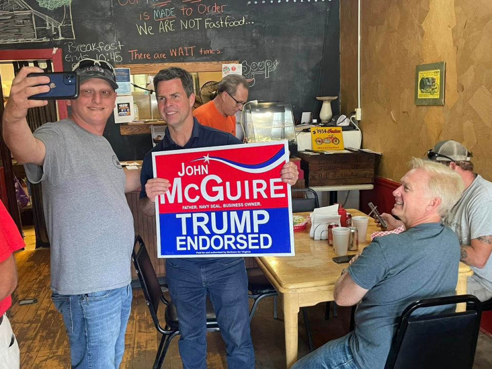 Trump-endorsed candidate John McGuire meets voters in June 2024 at a campaign stop. His primary race against Good was closer than many had expected (Facebook: John McGuire)