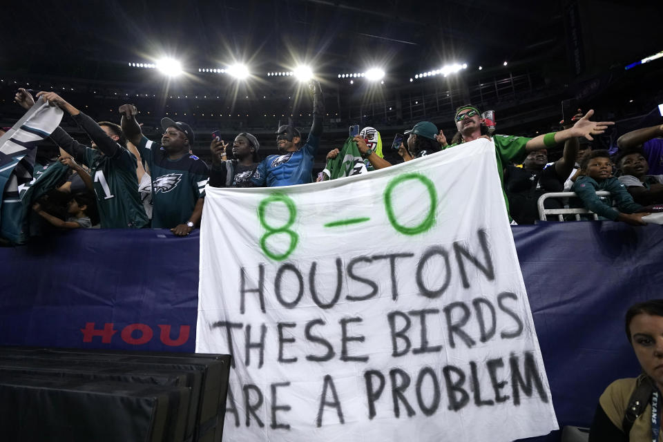 Philadelphia Eagles fans hold a sign after an NFL football game against the Houston Texans in Houston, Thursday, Nov. 3, 2022. The Eagles won 29-17. (AP Photo/Tony Gutierrez)