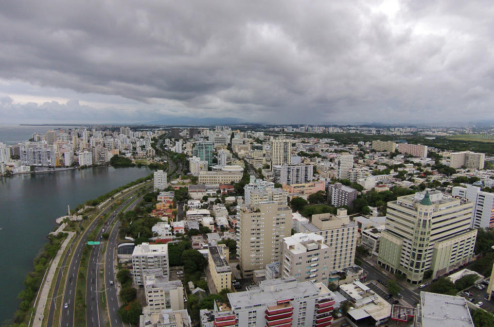 An aerial view taken from a drone of storm clouds hanging over San Juan, Puerto Rico, May 11, 2014. (AP Photo/Ricardo Arduengo)