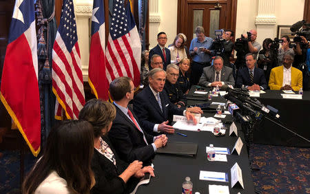 Texas Governor Greg Abbott hosts a round table discussion, on school safety to prevent another mass shooting, at the Texas Capitol in Austin, Texas, U.S., May 22, 2018. REUTERS/Jon Herskovitz