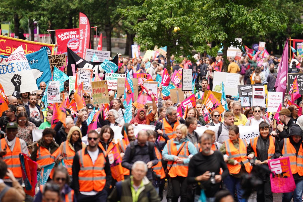 Members of the National Education Union (NEU) take part in a rally through Westminster to Parliament Square, London, as teachers stage walkouts across England in an ongoing dispute over pay. Picture date: Wednesday July 5, 2023.