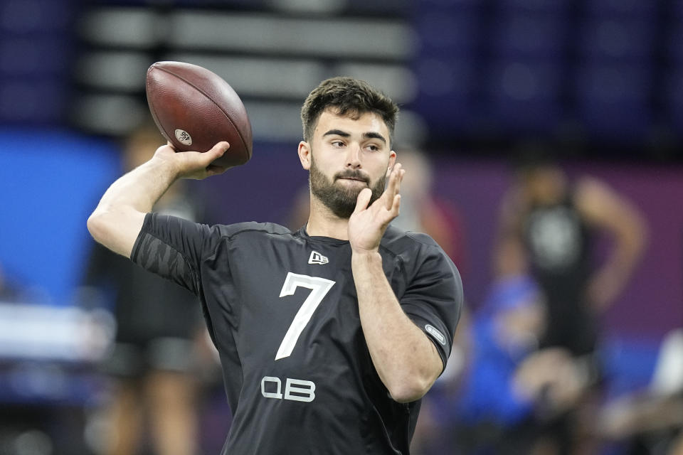 North Carolina quarterback Sam Howell throws during the NFL football scouting combine, Thursday, March 3, 2022, in Indianapolis. (AP Photo/Darron Cummings)