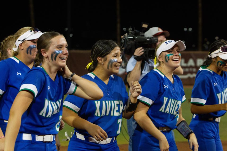 Xavier celebrates their state championship win at Alberta B. Farrington Softball Stadium in Tempe on May 13, 2024.