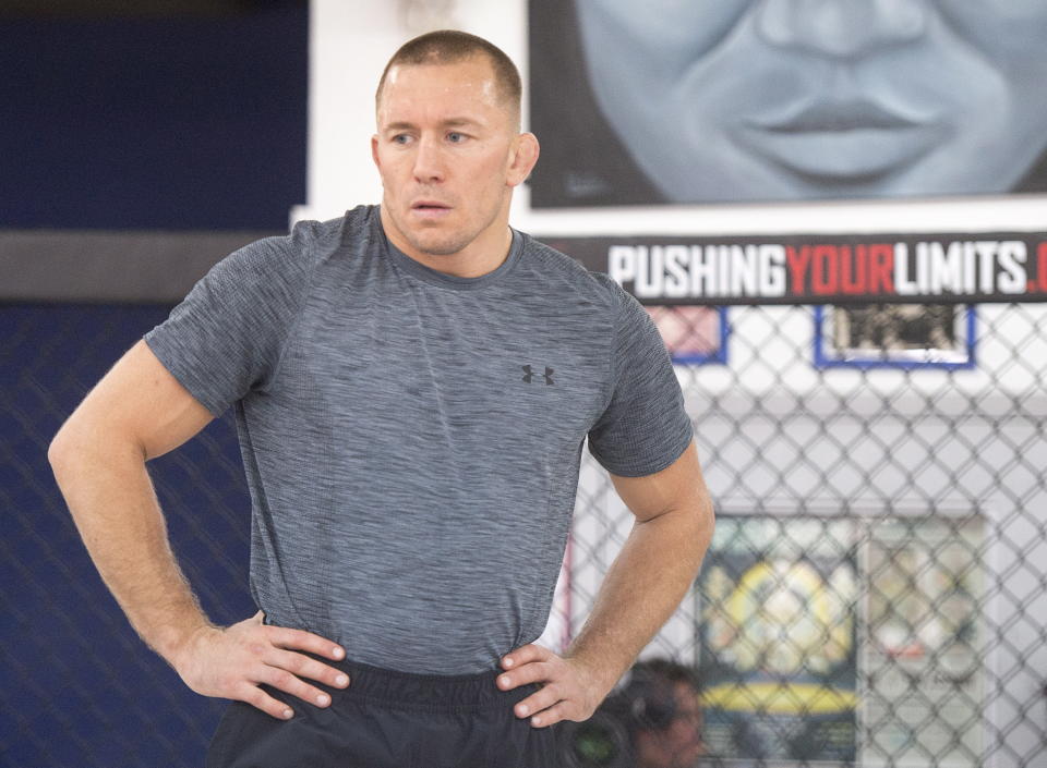 Georges St-Pierre will return to the Octagon for the first time in four years at UFC 217. (AP)