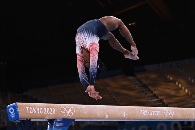 Simone Biles competes in the artistic gymnastics women's balance beam final of the Tokyo 2020 Olympic Games at Ariake Gymnastics Centre in Tokyo on Aug. 3, 2021.  (Photo: LIONEL BONAVENTURE via Getty Images)
