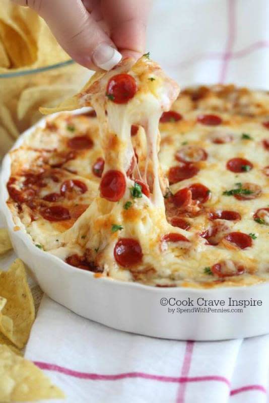 <p>Spend With Pennies</p><p>Instead of calling for pizza delivery, make this Cheesy Pizza Dip from Spend With Pennies instead. It'll be ready to eat faster than the delivery guy can drive. </p><p><strong>Get the recipe: <a href="http://www.spendwithpennies.com/easy-cheesy-pizza-dip/" rel="nofollow noopener" target="_blank" data-ylk="slk:Cheesy Pizza Dip;elm:context_link;itc:0;sec:content-canvas" class="link rapid-noclick-resp">Cheesy Pizza Dip</a></strong></p>