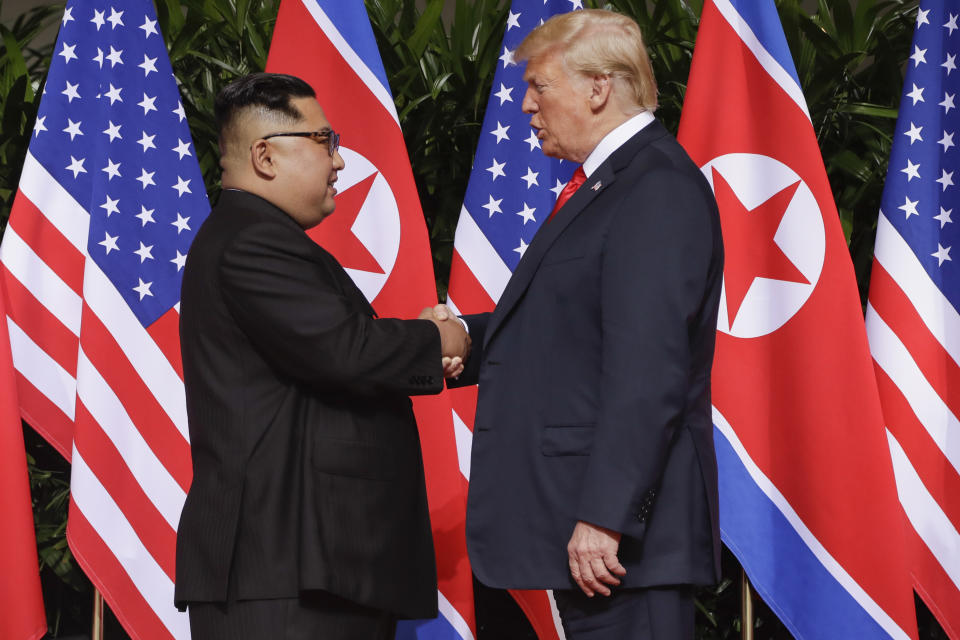 U.S. President Donald Trump shakes hands with North Korea leader Kim Jong Un at the Capella resort on Sentosa Island Tuesday, June 12, 2018 in Singapore. (AP Photo/Evan Vucci)