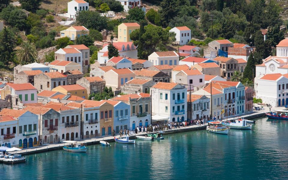 view of Kasterllorizo rooftops by harbour - David C Tomlinson /The Image Bank RF 