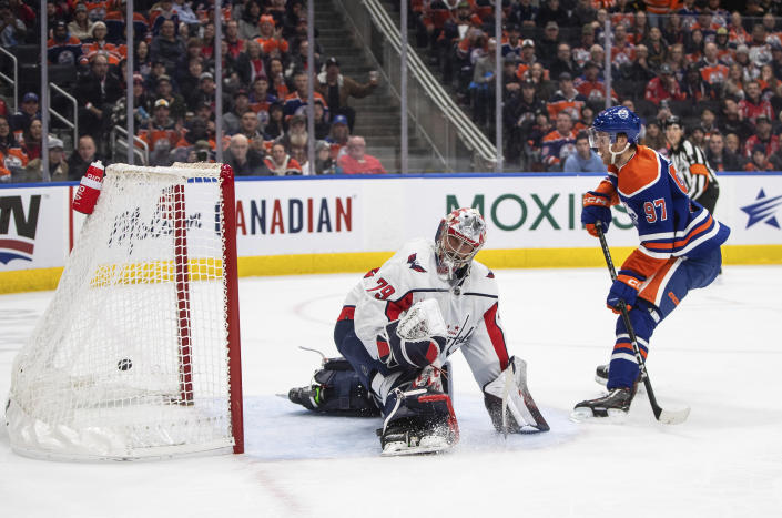 Washington Capitals goalie Charlie Lindgren (79) is scored on by Edmonton Oilers' Connor McDavid (97) during the second period of an NHL hockey game in Edmonton, Alberta, Monday, Dec. 5, 2022. (Jason Franson/The Canadian Press via AP)