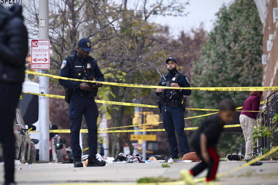 Baltimore City Police officers work in the 2600 block of Wilkens Avenue in the Milhill neighborhood, of southwest Baltimore, on Tuesday, Nov. 7, 2023, where the department said an officer was shot. (Jerry Jackson/The Baltimore Sun via AP)