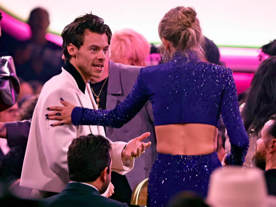 Harry Styles and Taylor Swift speak during the 65th GRAMMY Awards at Crypto.com Arena on February 05, 2023 in Los Angeles, California