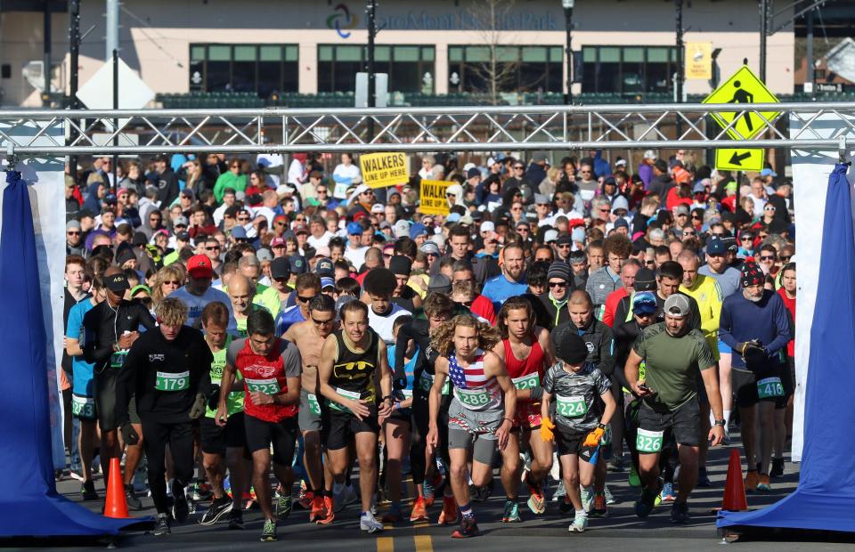 Runner start of the Gaston Community Foundation 5K Run early Saturday morning, April 9, 2022, outside CaroMont Health Park.