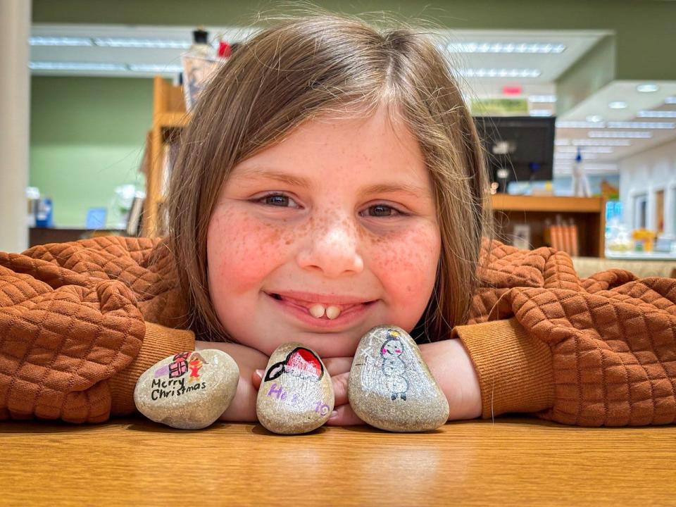 Lucy Briggs, 7, is spreading joy through Oak Harbor by hiding her hand-painted rocks around the village.