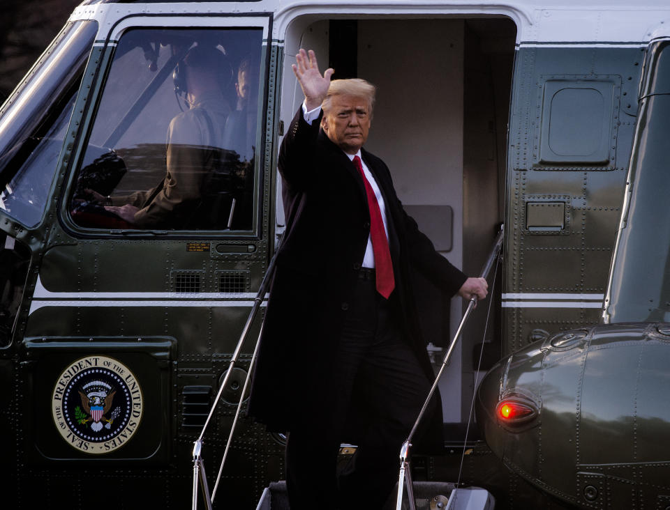 WASHINGTON, DC - January 20:  President Donald Trump gives a final wave as he boards Marine One as he and First Lady Melania Trump depart the White House for the last time in Washington, DC. (Photo by Bill O'Leary/The Washington Post via Getty Images)