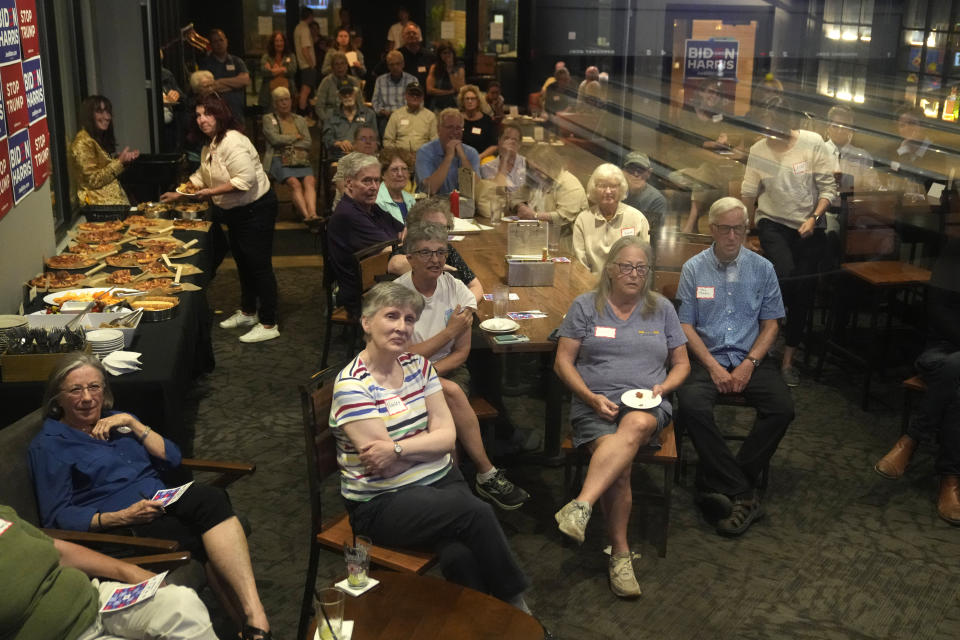 A crowd watch the presidential debate between President Joe Biden and Republican presidential candidate former President Donald Trump, at a watch party at Broadway Bowl, Thursday, June 27, 2024, in South Portland, Maine. (AP Photo/Robert F. Bukaty)