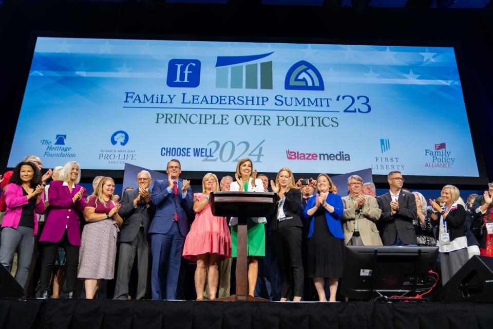 Governor Kim Reynolds signs a 6-week 'fetal heartbeat' abortion ban during the Family Leadership Summit in Des Moines, Friday, July 14, 2023. 