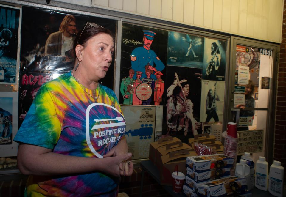 Owner Sharon Sandridge speaks with a reporter during Record Store Day at Positively Records in Levittown. The store opened from midnight to 2 a.m. for the day that celebrates independent record shops, vinyl and music. Several artist put out limited edition vinyls for the day.