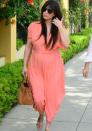 Celebrities in pastel fashion: Kim Kardashian opted to wear this loose coral jumpsuit in her pregnancy.<br><br>© Rex