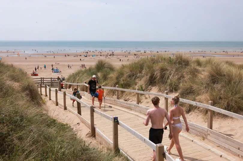 People enjoy the hot weather on Formby beach