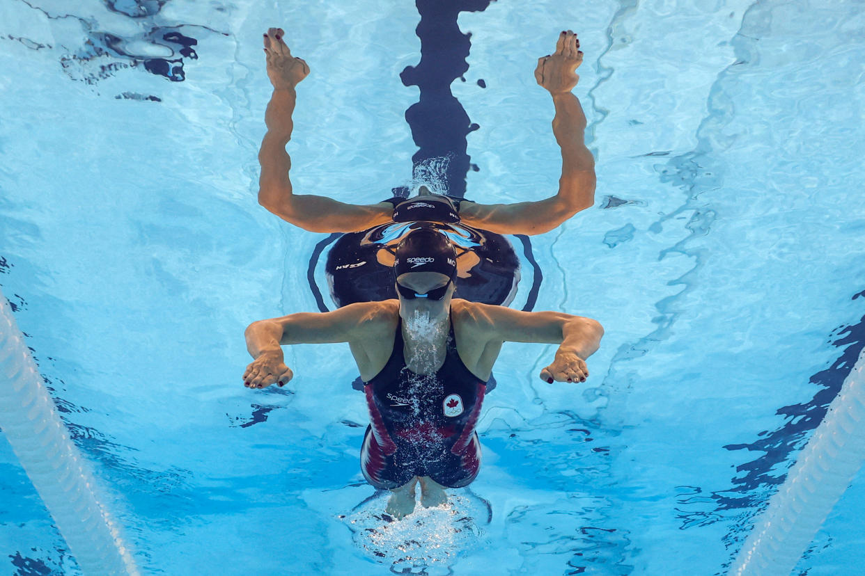 Summer McIntosh of Canada viewed from below during the Women's 400m individual medley swimming heats.