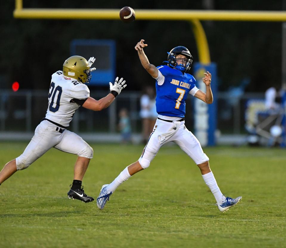 John Carroll Catholic quarterback Jax Vanname (7) attempts a pass during a high school football game Friday night against Calvary Christian on Friday Sept. 1, 2023 in Fort Pierce.