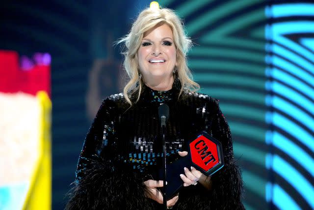 <p>Jeff Kravitz/Getty</p> Trisha Yearwood accepts the June Carter Cash Humanitarian Award onstage during the 2024 CMT Music Awards at Moody Center on April 07, 2024 in Austin, Texas