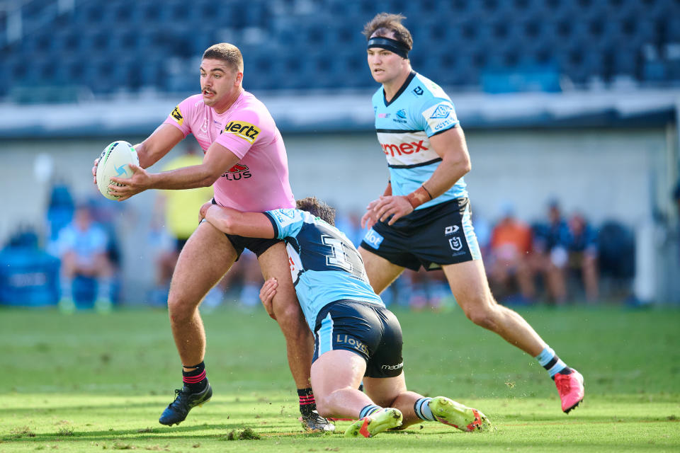 SYDNEY, AUSTRALIA - FEBRUARY 20: Mavrik Geyer of the Panthers is tackled during the NRL Trial Match between the Penrith Panthers and the Cronulla Sharks at CommBank Stadium on February 20, 2022 in Sydney, Australia. (Photo by Brett Hemmings/Getty Images)