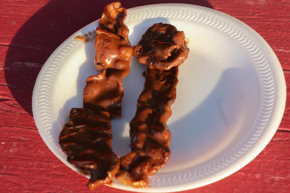 Chocolate bacon prepared at a volunteer tent which is selling food to raise money for Clark Montessori Schools at the Bacon, Bourbon, and Brew Festival in 2018.