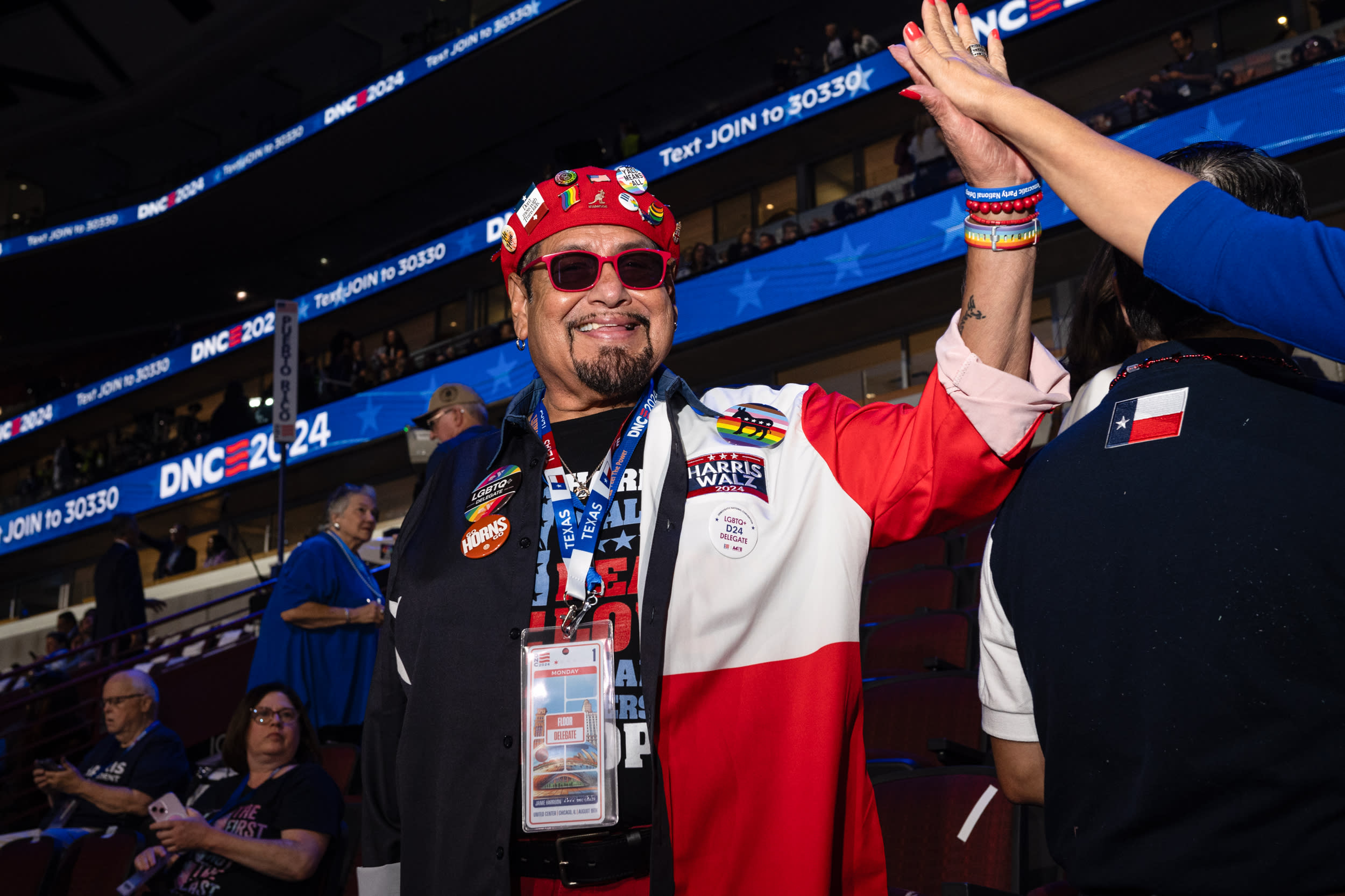 A Texas delegate gets a high five on the first night of the convention. (Laura Brett/ZUMA Press Wire)