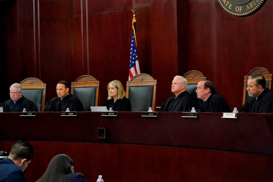 PHOTO: Arizona Supreme Court Justices from left; William G. Montgomery, John R Lopez IV, Vice Chief Justice Ann A. Scott Timmer, Chief Justice Robert M. Brutinel, Clint Bolick and James Beene listen to oral arguments on April 20, 2021, in Phoenix. (Matt York/AP, FILE)