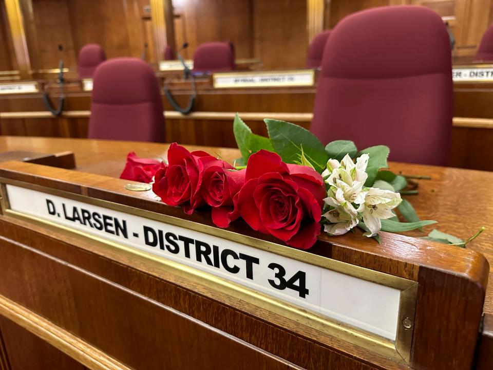 Roses rest on the Senate desk of late North Dakota Republican state Sen. Doug Larsen, at the state Capitol on Oct. 2, 2023, in Bismarck, N.D. Larsen, his wife Amy, and their two young children died Sunday in a plane crash near Moab, Utah.