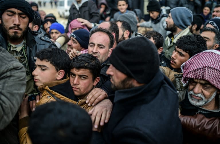 Thousands of Syrians who have fled the fighting near the northern city of Aleppo wait near the Turkish border, on February 6, 2016