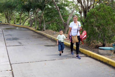 Ines Guerrero arrives home with her grandson Derek Ruiz after picking him up at school in Guatire, Venezuela November 14, 2018. Picture taken November 14, 2018. REUTERS/Marco Bello