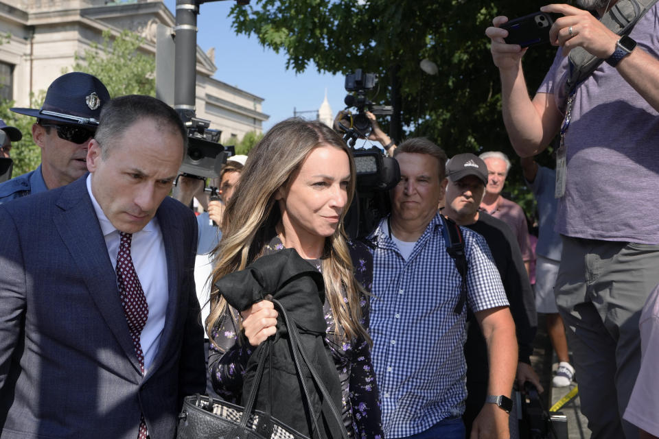 Karen Read, center, departs Norfolk Superior, Tuesday, June 25, 2024, in Dedham, Mass. Karen Read is on trial, accused of killing her boyfriend Boston police Officer John O'Keefe, in 2022. Jury deliberations began in the trial Tuesday afternoon. (AP Photo/Steven Senne)