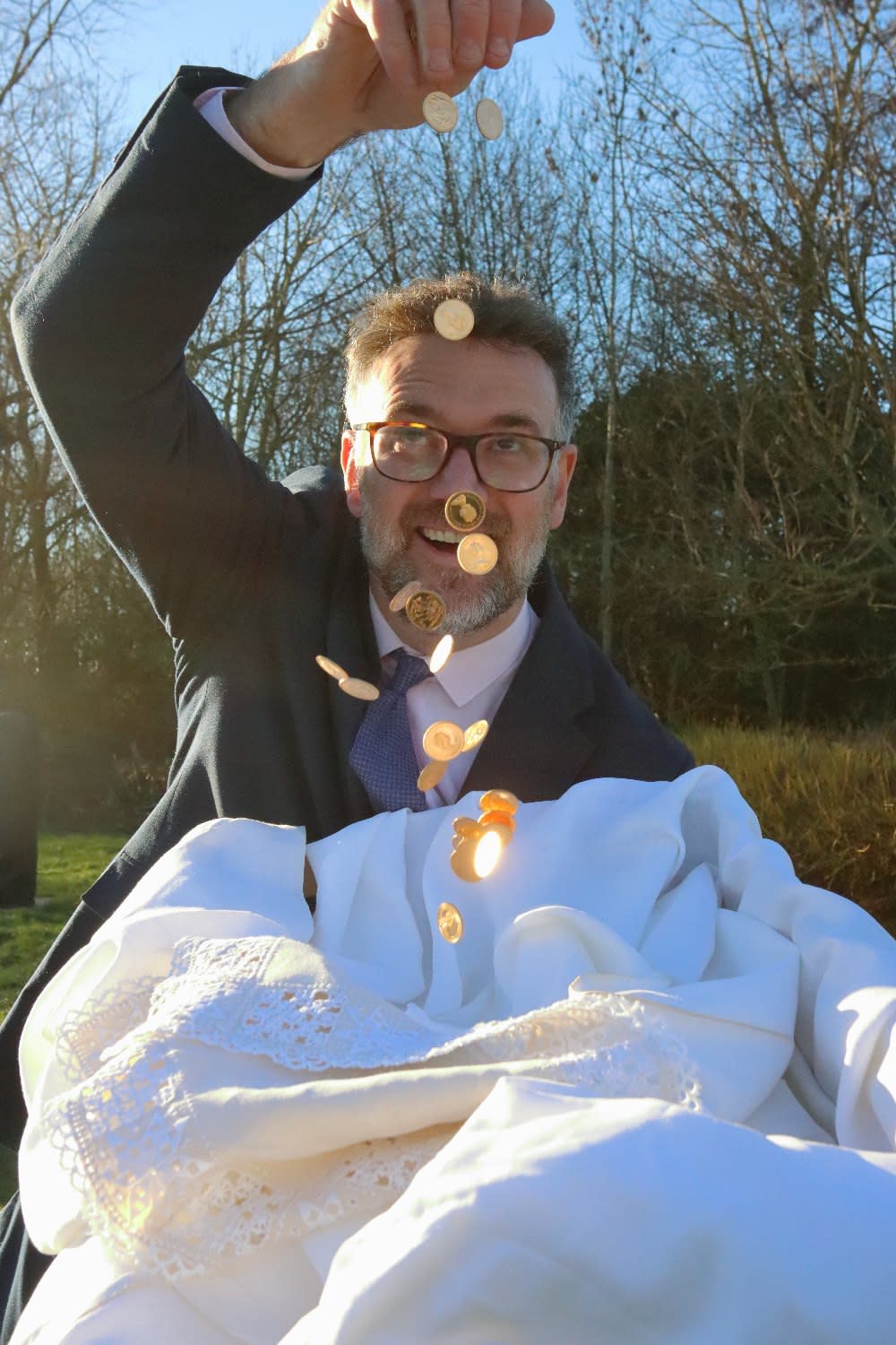 Charles Hanson with some of the gold coins found in a linen box