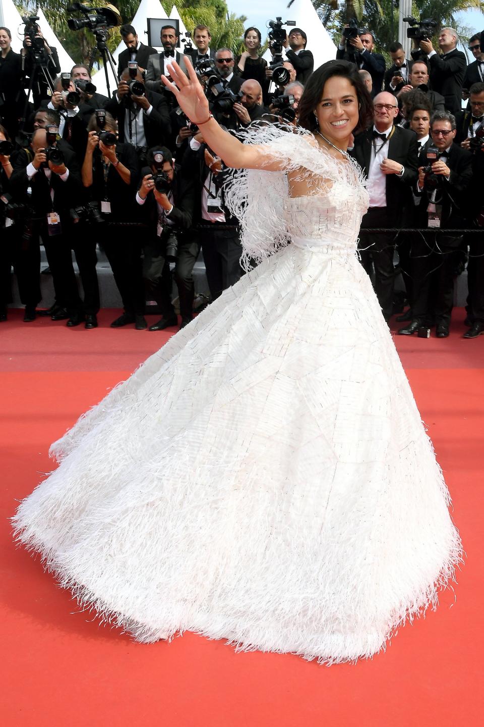 The actress has a princess moment in her white feathered ballgown worn to the Once Upon a Time in Hollywood premiere.