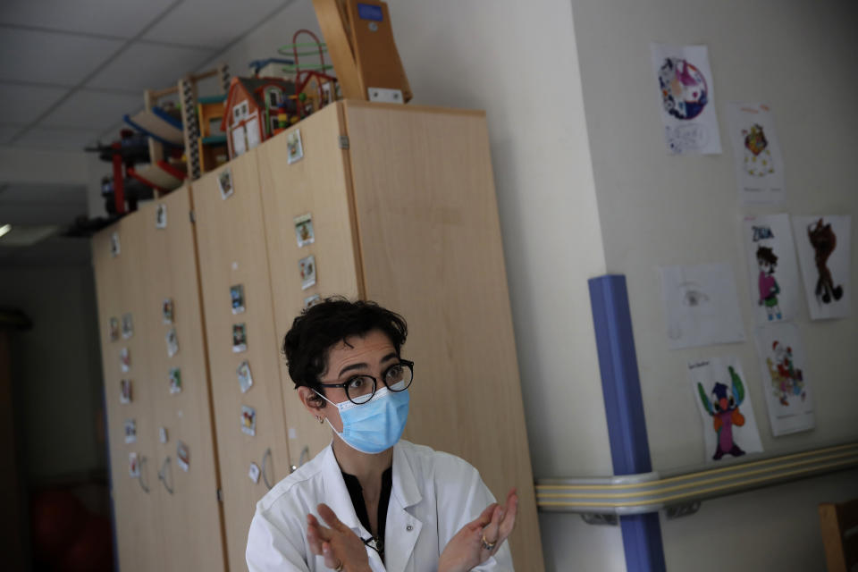 Psychiatrist Anna Maruani speaks during an interview in the pediatric unit of the Robert Debre hospital, in Paris, France, Tuesday, March 2, 2021. (AP Photo/Christophe Ena)