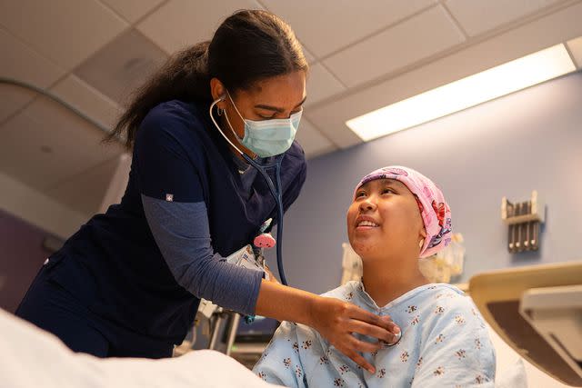 <p>Maanasi Kademani/UCLA Health</p> Tae Butler with patient Angela Unayan at UCLA Health on July 13.