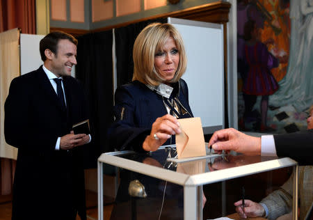 Brigitte Trogneux, wife of French presidential election candidate Emmanuel Macron, head of the political movement En Marche !, or Onwards !, casts her ballot in the second round of 2017 French presidential election, at a polling station in Le Touquet, France, May 7, 2017. REUTERS/Eric Feferberg/Pool